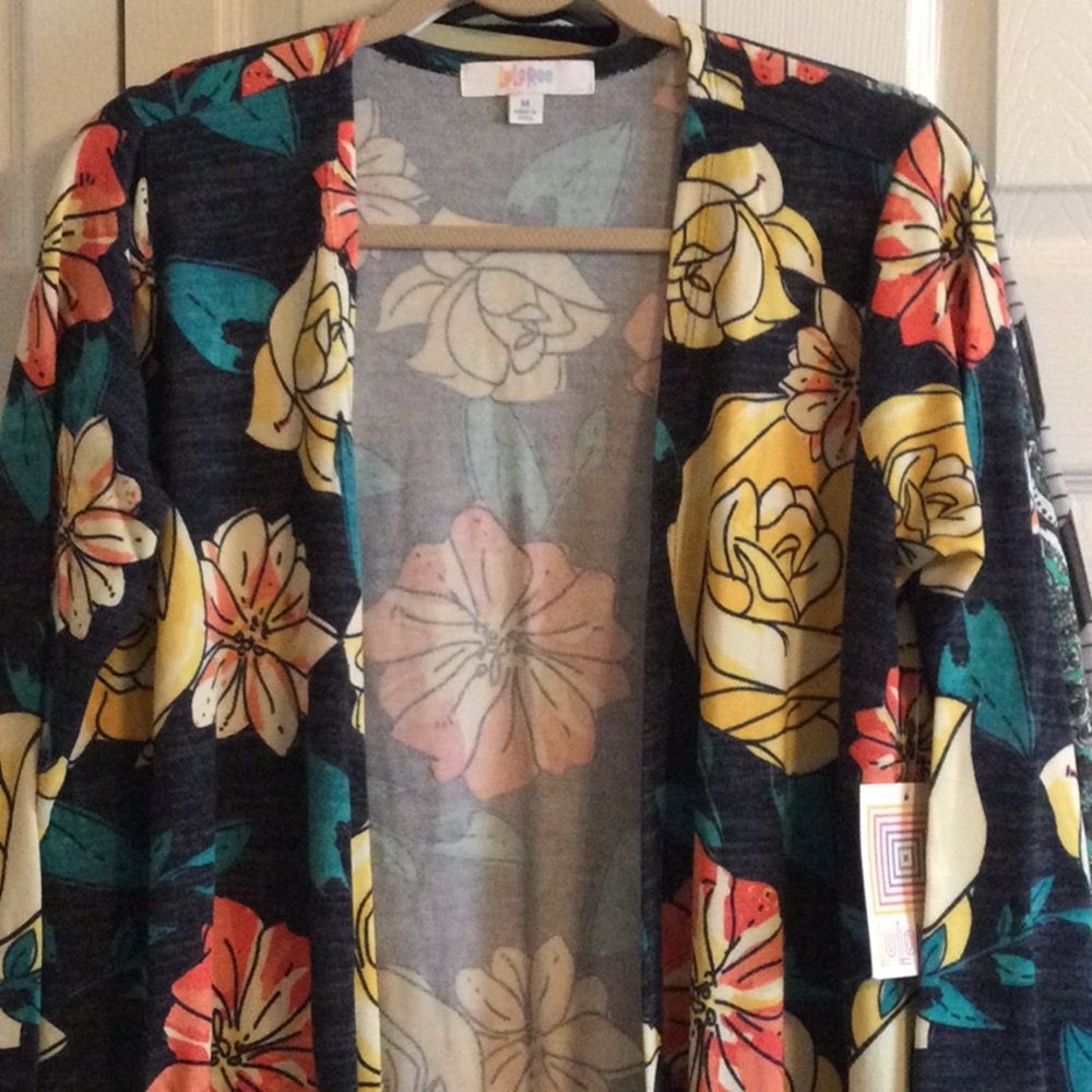 NWT Lularoe Sarah Sweater, size Medium. Navy with floral pattern in yellow